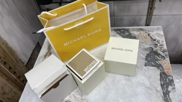 MICHAEL KORS watch box with outer cover, booklet, and cushion
